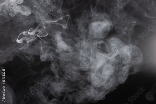 White steam on a black background.