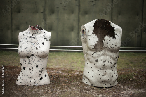 Rifle range with manequins covered with bullet holes photo