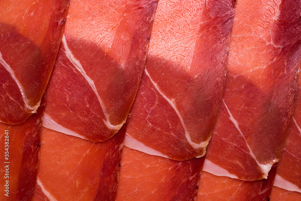 Tasty meat background, thinly sliced jamon. Tasty meat background, thinly sliced jamon.
