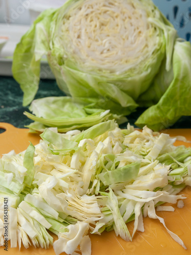 chopped cabbage and half cabbage head