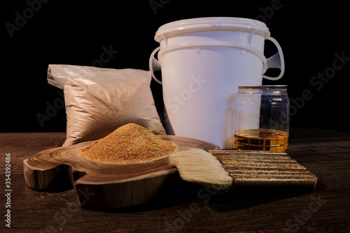 White shellac powder, which is mixed with alcohol for applying on wood to coat the surface of wood in furniture. 