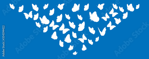 Silhouettes white of butterflies flying. Vector design. Background.
