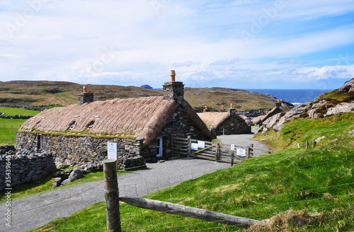 Gearrannan Blackhouse Village in the  Isle of Lewis in the Outer Hebrides of Scotland. There was no chimney for the smoke to escape through, therefore the soot blackened the interior of the houses 
 photo