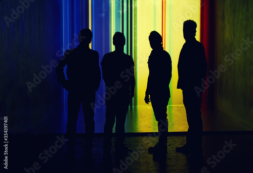 Silhouette of four people, unrecognised person in full length photo