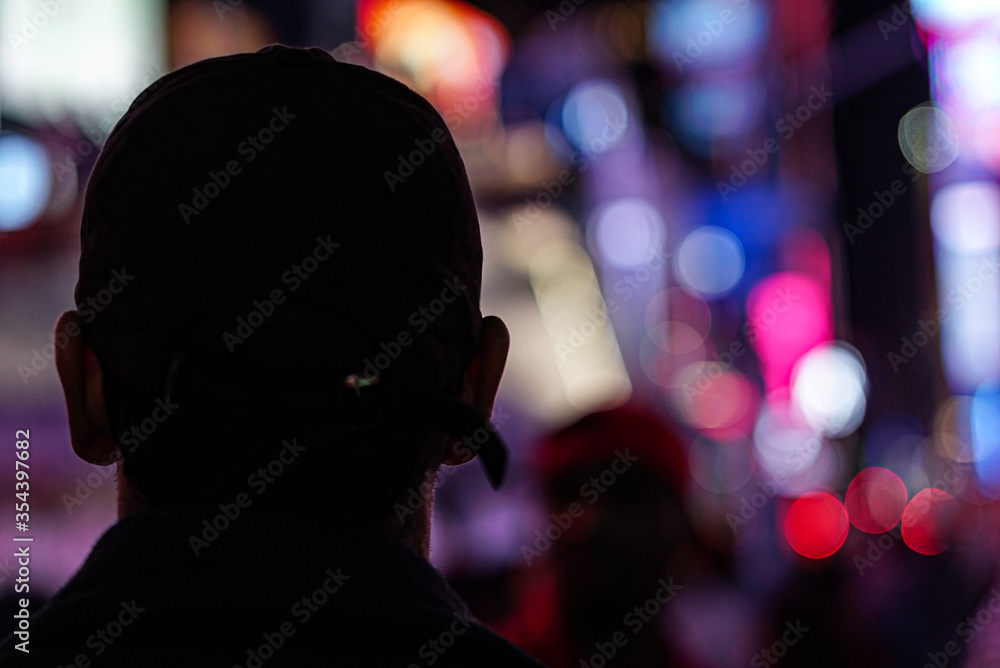 silhouette of man walking in city at night silhouette of man walking in city at night