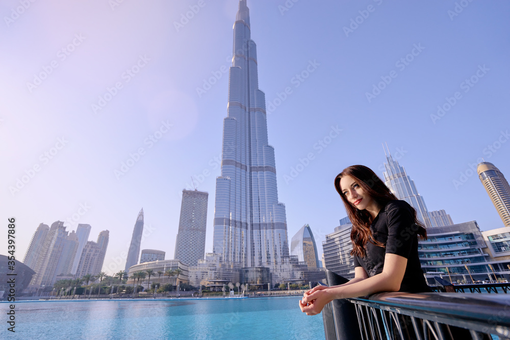 Young beautiful woman enjoying the view of Dubai downtown.