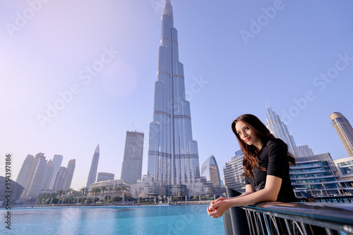 Young beautiful woman enjoying the view of Dubai downtown. © luengo_ua