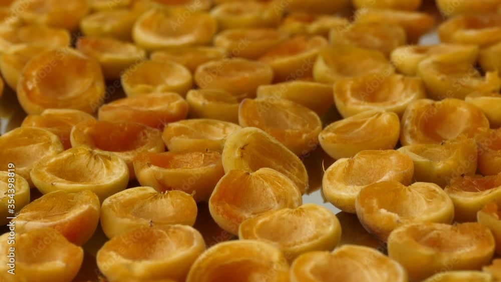 drying apricots in the sun, drying wet apricots, drying the sliced