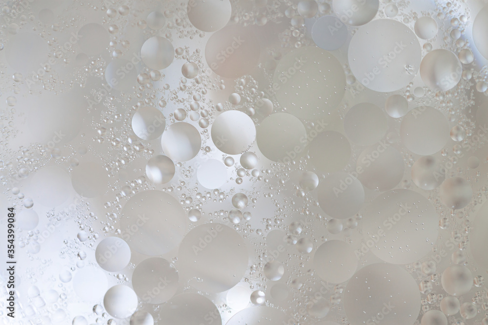 Fototapeta premium Beige tiny bubbles inside liquid macro unusual abstract wallpaper