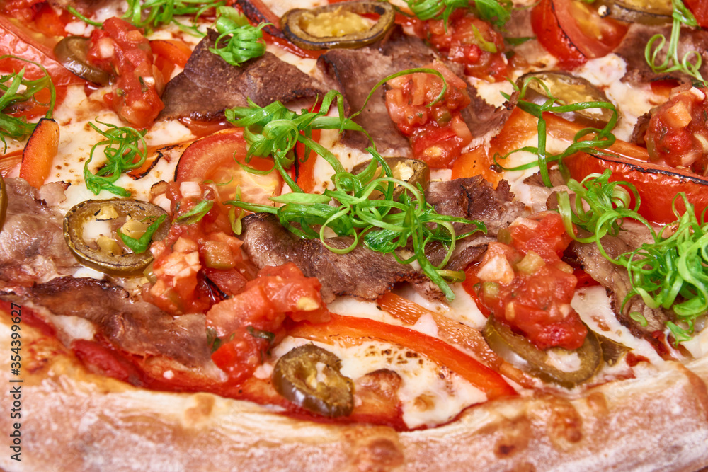 Mexican hot Pizza on wood decorated with spreaded wheat Mexican hot Pizza on wood decorated with spreaded wheat