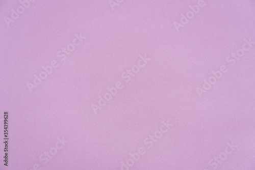 The texture of the fabric is a delicate pink color. Background, texture. The basis for a postcard. Pastel shade.