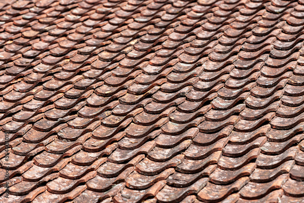 Fragment of an old Tiled roof. Background, texture Fragment of an old Tiled roof. Background, texture