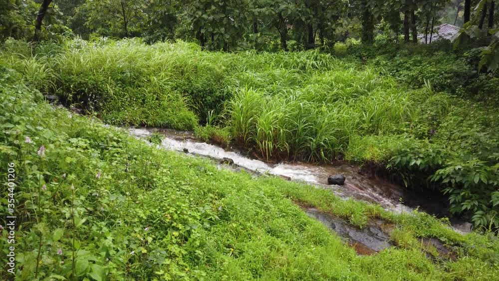A beautiful small creek in middle of farming land. A beautiful small creek in middle of farming land.