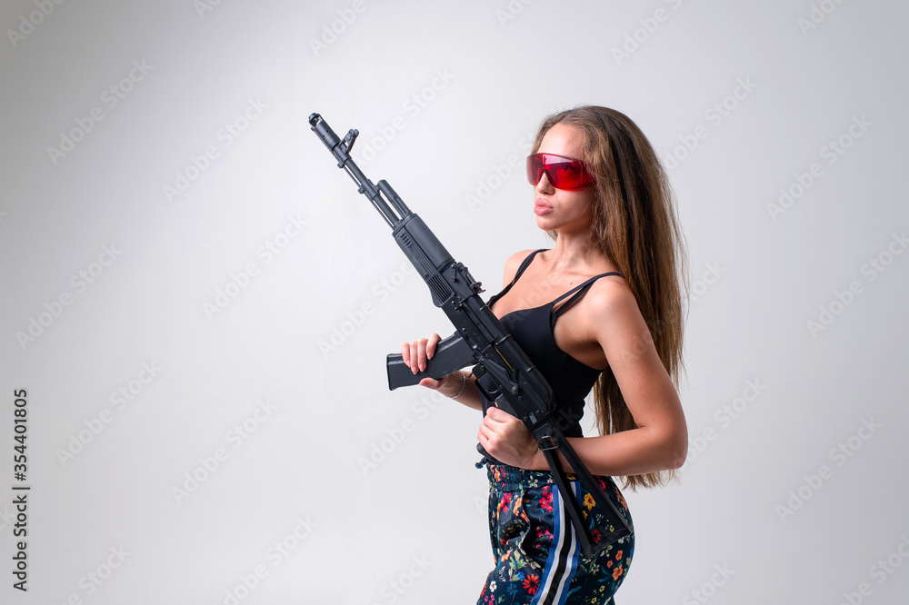 Beautiful woman with rifle plastic. Army girl Holding Gun Beautiful woman with rifle plastic. Army girl Holding Gun
