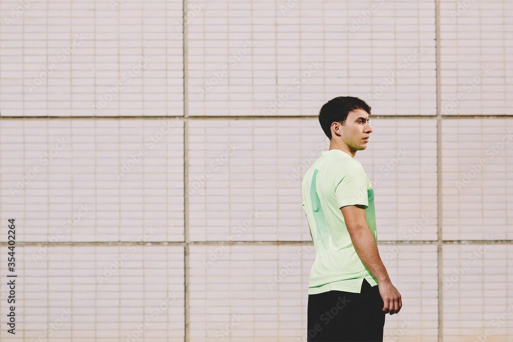 Young male guy in sports wear outdoors Young male guy in sports wear outdoors