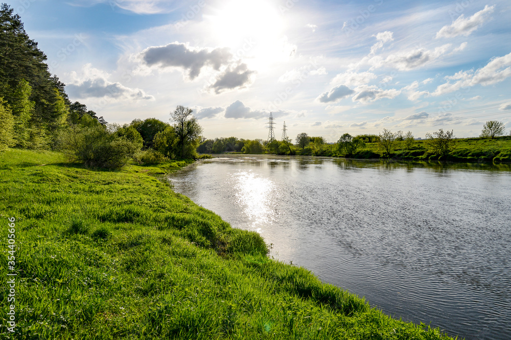 Fototapeta premium landscape with river, green grass and trees