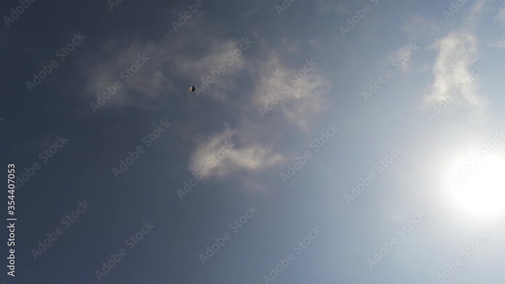 kite flying in the blue sky with clouds kite flying in the blue sky with clouds