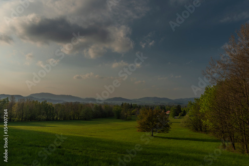 Color sunset with fresh meadows and old buidlings near Trojanovice village © luzkovyvagon.cz
