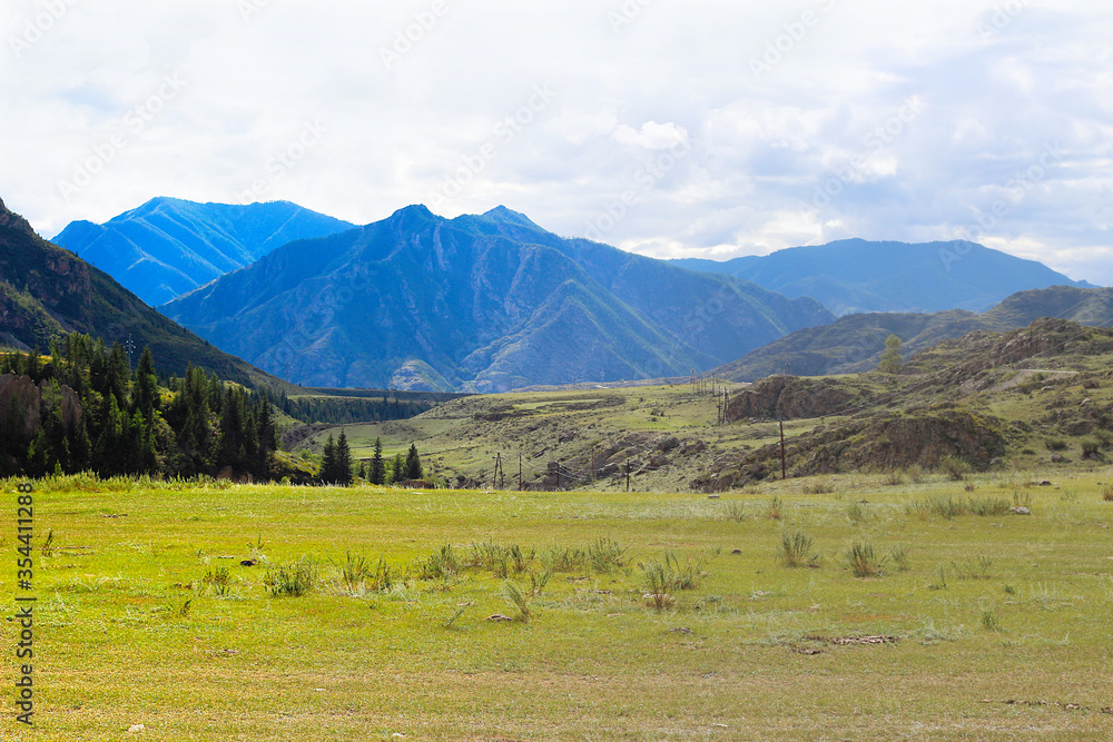 Wonderful mountain landscape with blue sky. Altai Republic, Russia. High green mountains and clean health air
