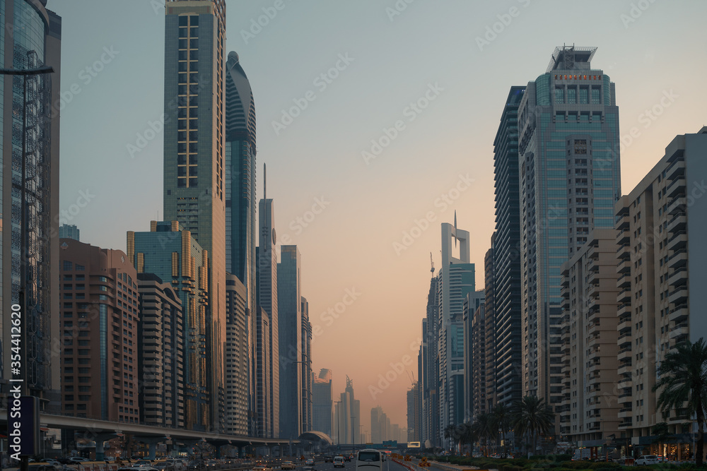 Beautiful Dubai downtown road in city center skyline with many skyscrapers buildings, United Arab Emirates.