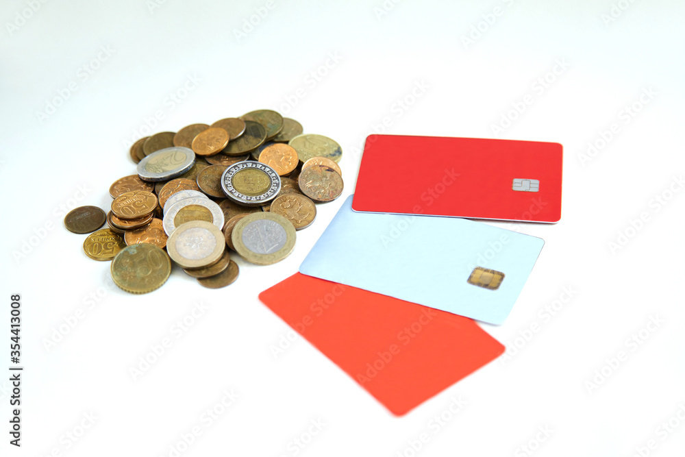 There are three plastic credit cards on a white background. The concept of getting a loan and successful purchases with discounts, exchanging iron money for Bank cards