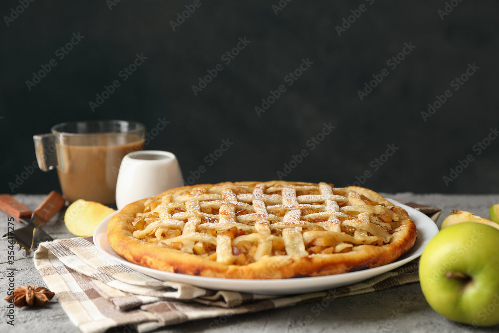 Composition with apple pie and ingredients on gray background. Homemade food Composition with apple pie and ingredients on gray background. Homemade food