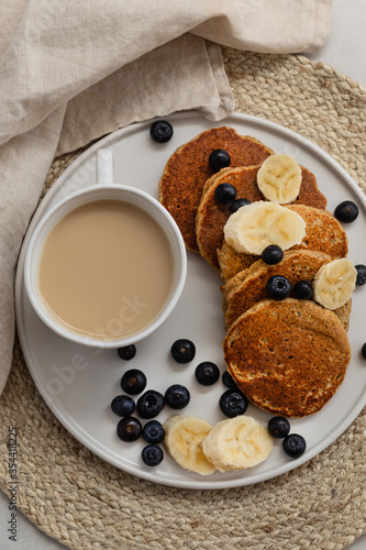 Breakfast platter with coffee latte and oatmeal pancakes