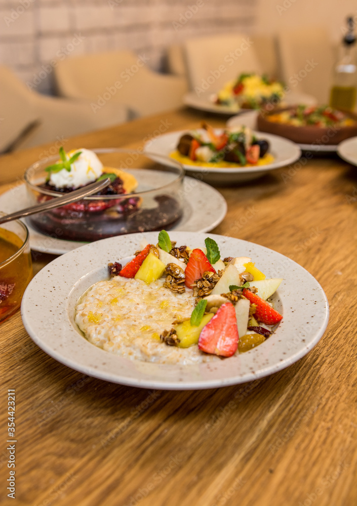 breakfast in a restaurant on a wooden table breakfast in a restaurant on a wooden table