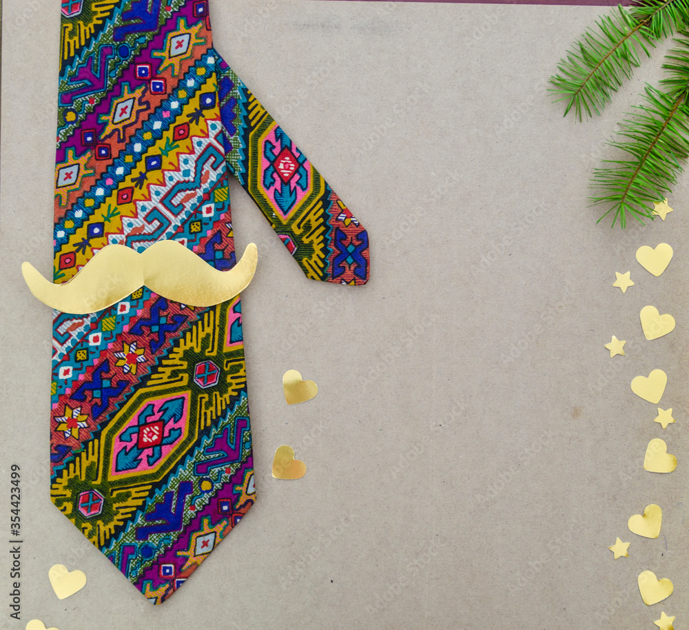Father`s day concept - hipster tie, mustache, heart on wood background with space for text. Vertical.