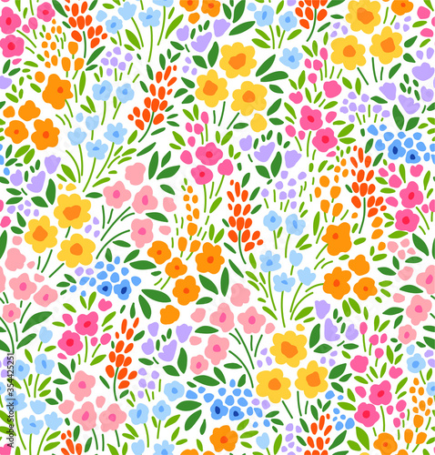 Floral pattern. Pretty flowers on white background. Printing with small colorful flowers. Ditsy print. Seamless vector texture. Spring bouquet.