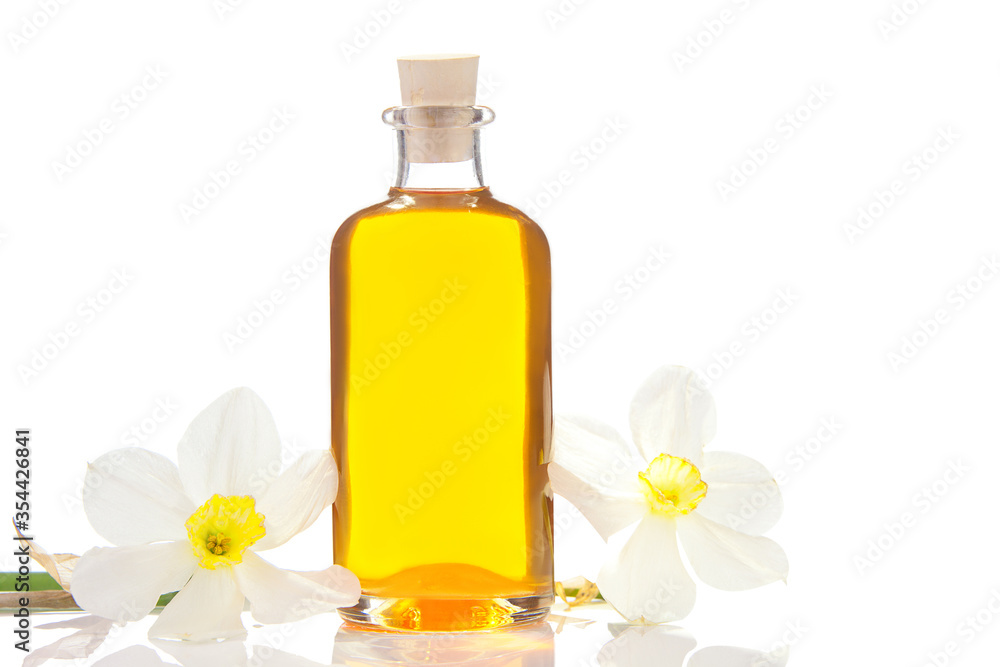 Essence of flowers on white in beautiful glass jar Essence of flowers on white in beautiful glass jar