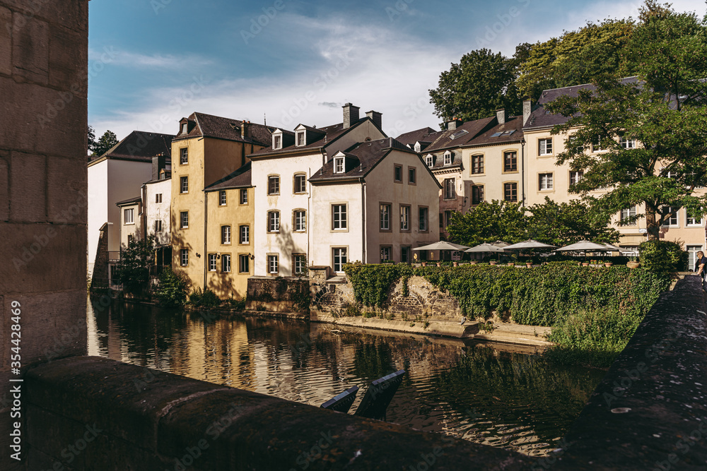Alzette river crossing the historical old town of Luxembourg, called Grund