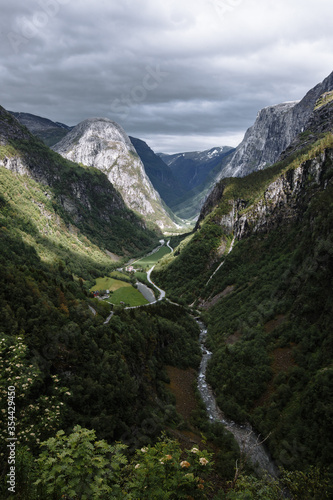 Vertical Norwegian landscape. The gorge where the small Northern village is located