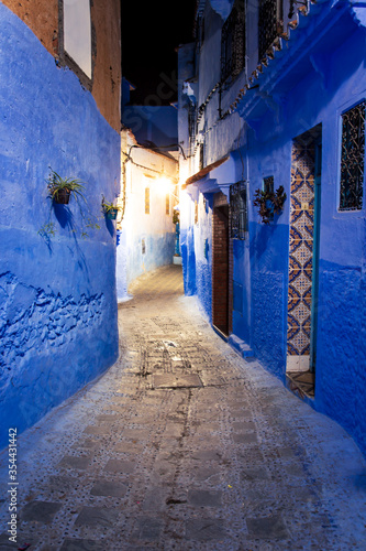 The famous blue city of Chefchaouen at night. Details of traditional Moroccan architecture.