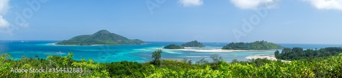 Beautiful tropical seascape with crystal clear sea water turquoise color sand blue sky. Tropical background scenic.