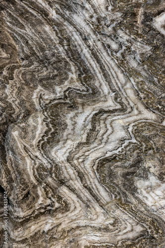 Abstract gray texture of natural, raw salt in an underground salt mine