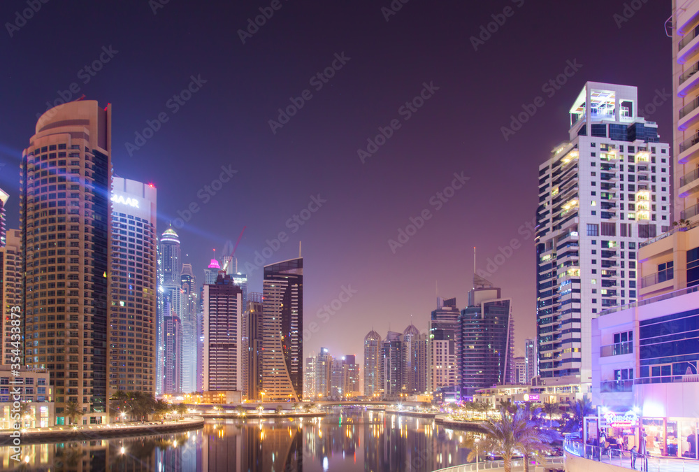 Fototapeta premium DUBAI - OCTOBER 17.2018: Skyscrapers in Night Dubai Marina. Editorial photo.