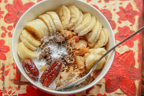 Healthy breakfast recipe with mixed fruit, oatmeal, date bananas.  