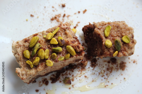 Guten free chocolate cake topped with pistacio 