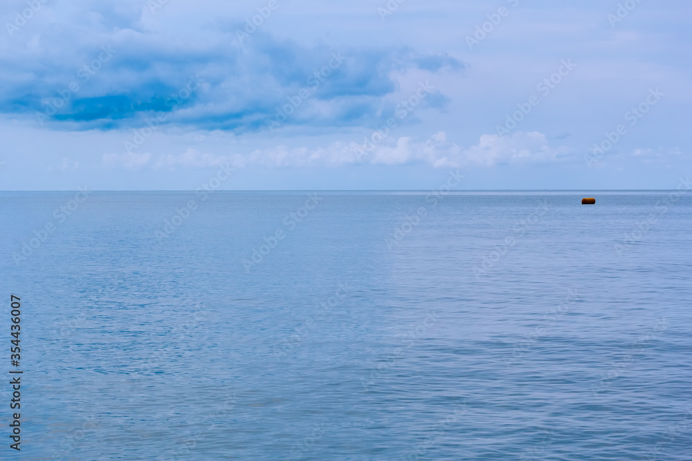 Serene seascape with clouds above the sea