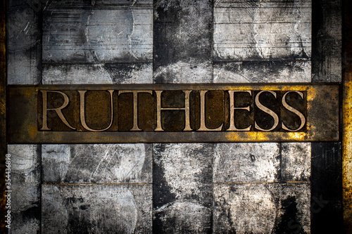 Photos Photo of real authentic typeset letters forming Ruthless text on vintage texture
