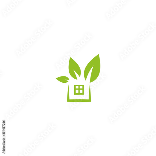 Flat green home with green leaf inside. Simple silhouette of the house