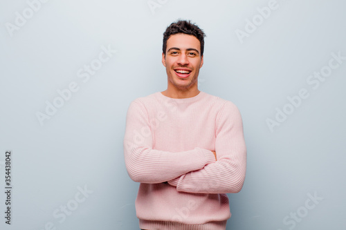 Photos young arabian man looking like a happy, proud and satisfied achiever smiling wit