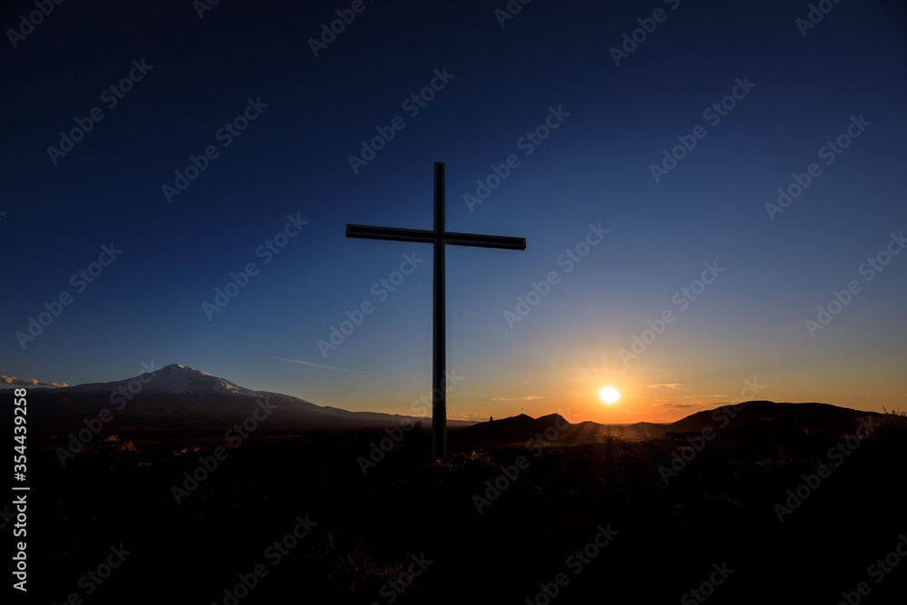 cross at the sunset
