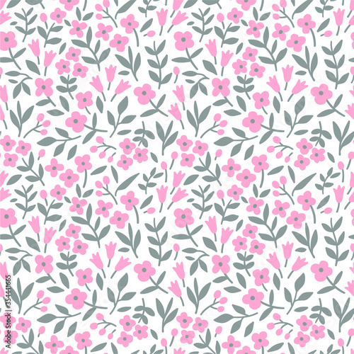 Floral pattern. Pretty flowers on white background. Printing with small pink flowers. Ditsy print. Seamless vector texture. Spring bouquet.