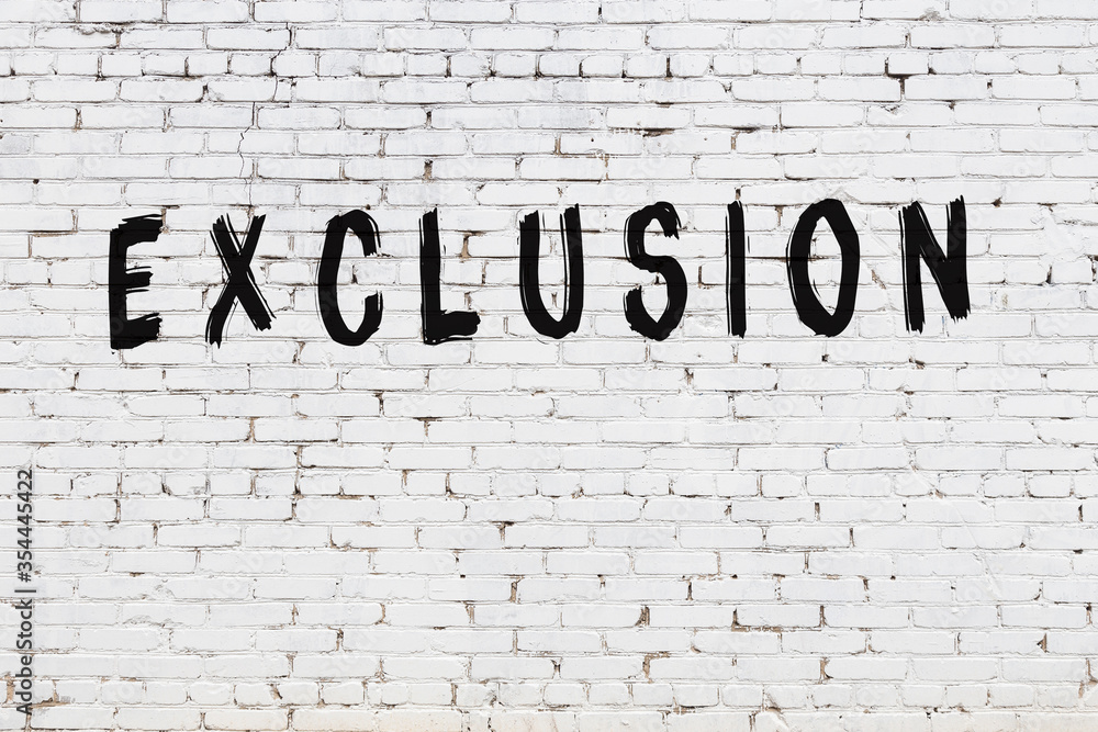 Fotografie Word exclusion painted on white brick wall