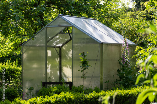 Idyllic garden with greenhouse in early summer late spring  © MW Photography 