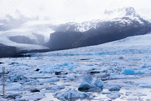 The beautiful Fjallsarjokull glacier and icebergs of the Fjallsarlon lagoon in the Vatnajokull National Park, Southeast Iceland.