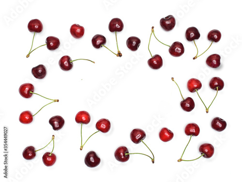 Fresh cherries isolated on white background. Knolling concept with copy space.