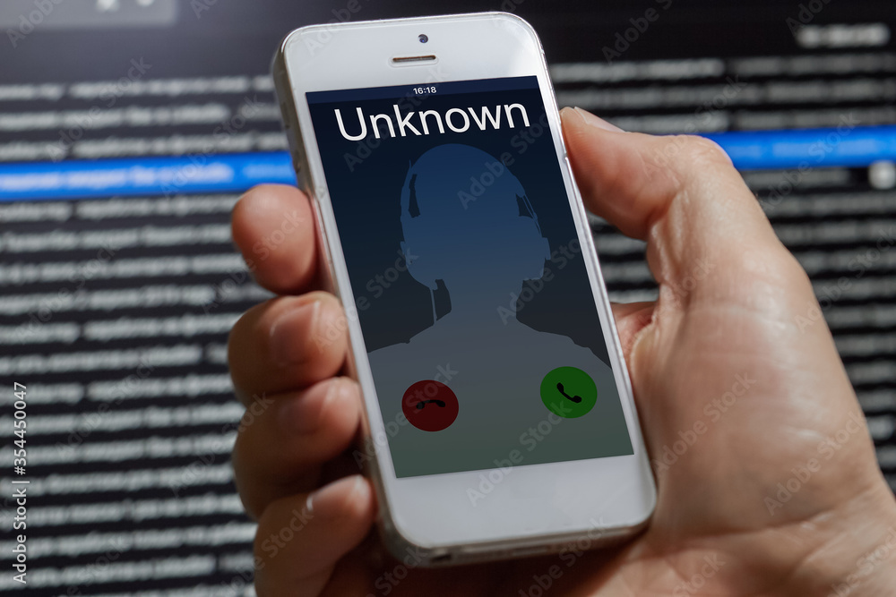 unwanted call to a mobile phone on a dark background unwanted call to a mobile phone on a dark background